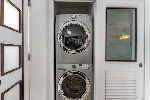 laundry area featuring stacked washer / dryer