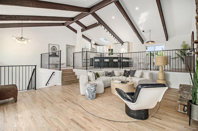 14890 W 58th Pl, Golden, CO 80403 - living area featuring wood finished floors, a chandelier, high vaulted ceiling, beam ceiling, and recessed lighting