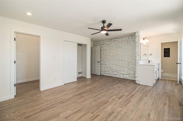 14890 W 58th Pl, Golden, CO 80403 - unfurnished bedroom featuring light wood finished floors and a ceiling fan