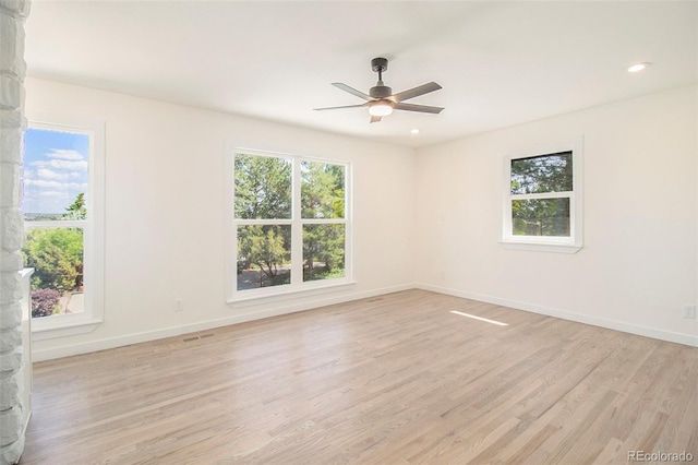 14890 W 58th Pl, Golden, CO 80403 - empty room with light wood-type flooring, healthy amount of natural light, a ceiling fan, and recessed lighting