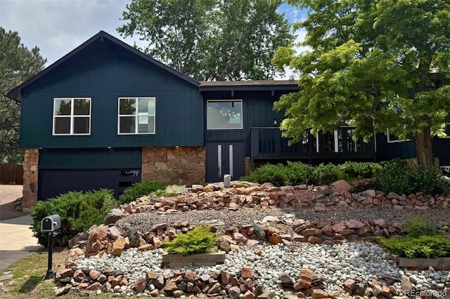 14890 W 58th Pl, Golden, CO 80403 - view of front of property with stone siding and driveway