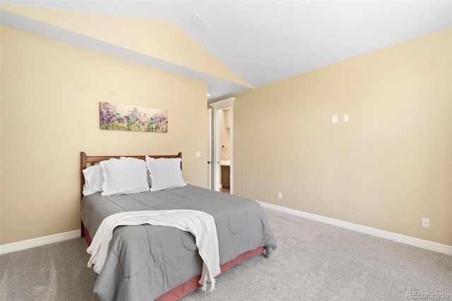 bedroom with vaulted ceiling and carpet flooring