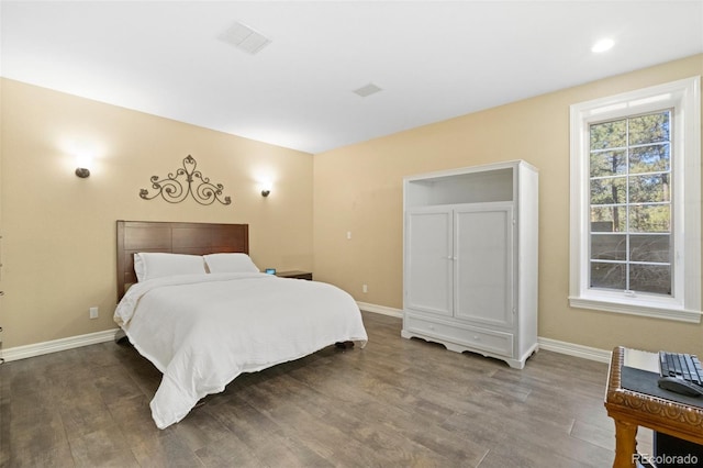 bedroom with hardwood / wood-style floors