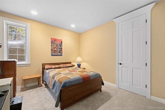 bedroom featuring light carpet