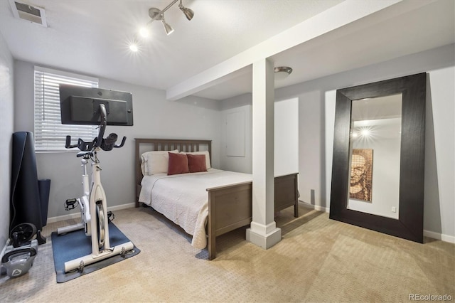 carpeted bedroom featuring baseboards