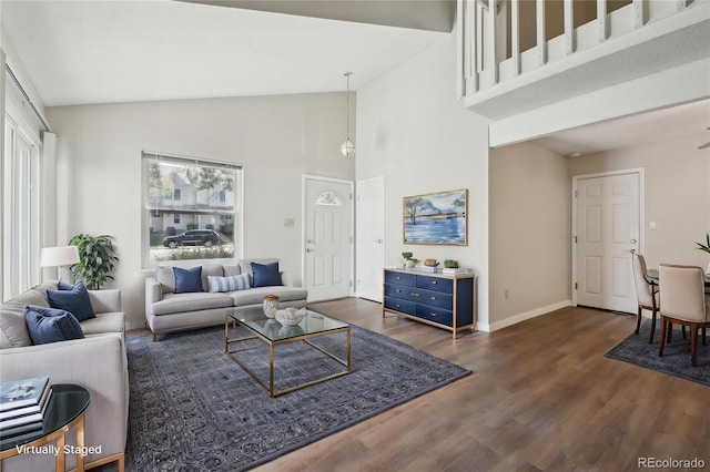 12115 Bannock St Unit B, Denver, CO 80234 - living room with high vaulted ceiling, wood finished floors, and baseboards