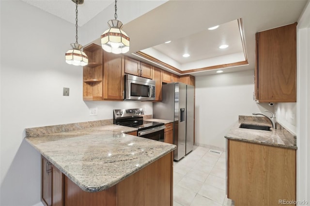 12115 Bannock St Unit B, Denver, CO 80234 - kitchen featuring stainless steel appliances, a sink, a peninsula, brown cabinets, and light stone countertops