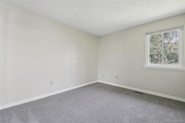 12115 Bannock St Unit B, Denver, CO 80234 - carpeted spare room featuring baseboards and a textured ceiling