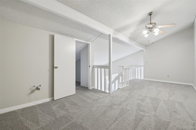 12115 Bannock St Unit B, Denver, CO 80234 - spare room with a ceiling fan, carpet flooring, a textured ceiling, vaulted ceiling, and baseboards