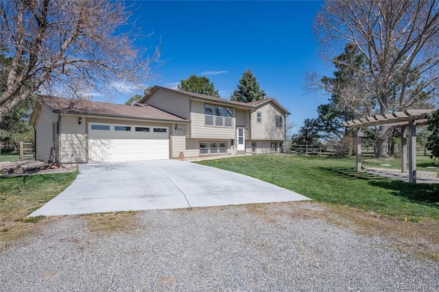bi-level home featuring a garage, a pergola, driveway, and a front yard