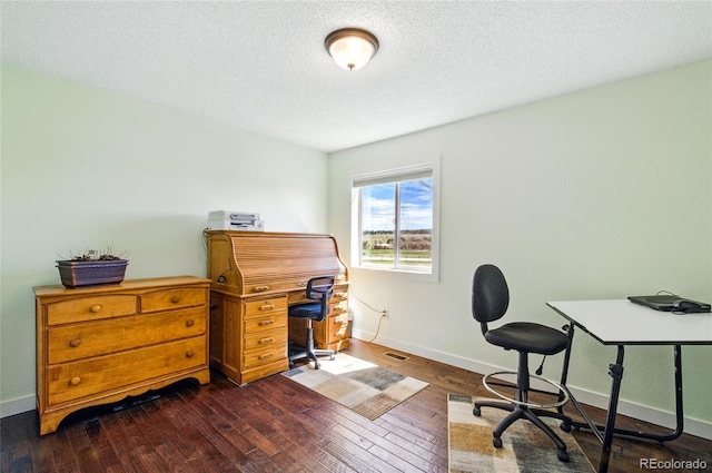 office featuring baseboards, a textured ceiling, and dark wood finished floors