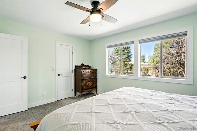 carpeted bedroom with baseboards and ceiling fan