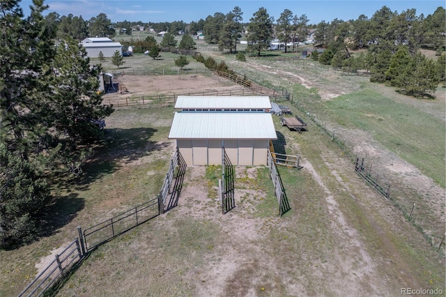 birds eye view of property featuring a rural view