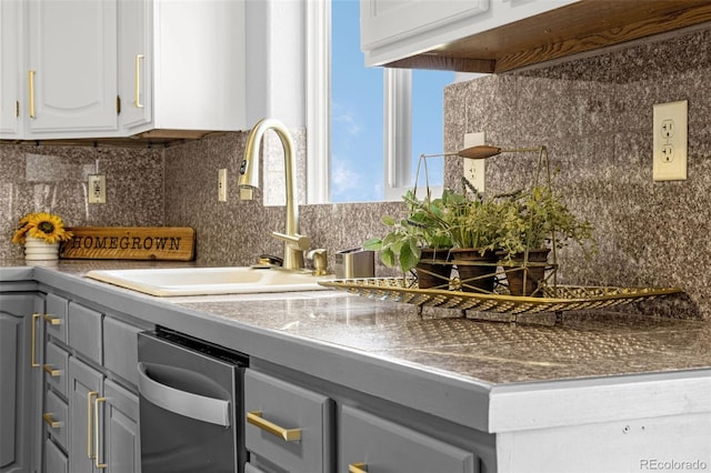 12255 Forest Green Dr, Elbert, CO 80106 - kitchen featuring gray cabinetry, a sink, backsplash, and white cabinets
