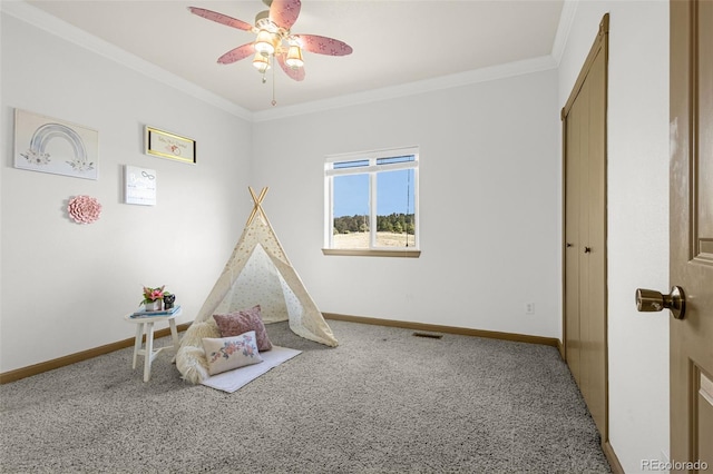 12255 Forest Green Dr, Elbert, CO 80106 - playroom featuring carpet flooring, a ceiling fan, baseboards, and ornamental molding