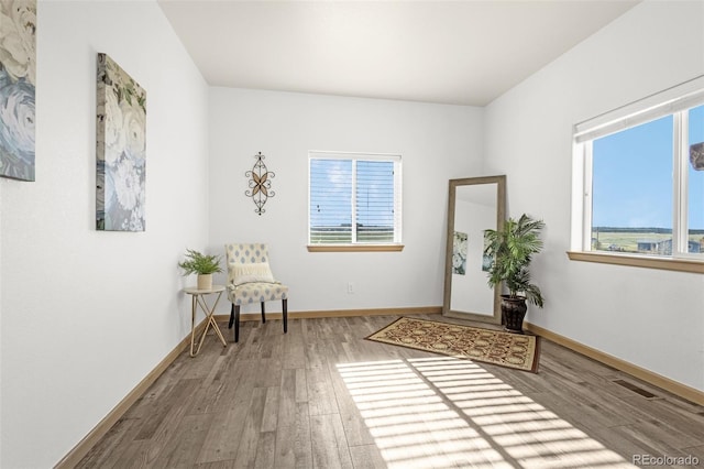 12255 Forest Green Dr, Elbert, CO 80106 - sitting room with wood finished floors and baseboards