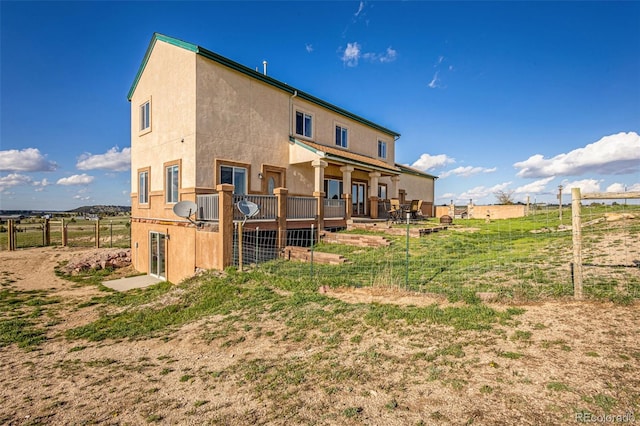 12255 Forest Green Dr, Elbert, CO 80106 - back of property with fence, stucco siding, and cooling unit