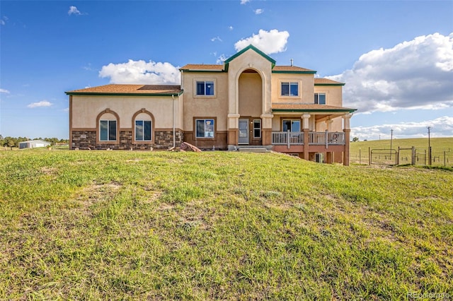 12255 Forest Green Dr, Elbert, CO 80106 - rear view of house featuring stucco siding and stone siding