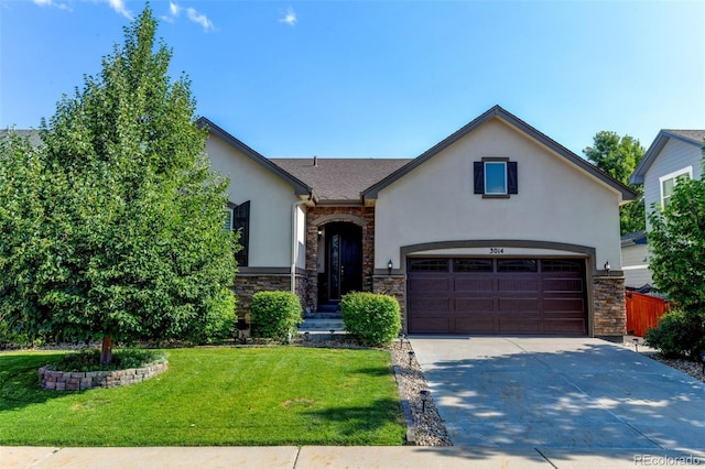 3014 E 143rd Dr, Thornton, CO 80602 - view of front of home featuring stucco siding, stone siding, driveway, and a front lawn