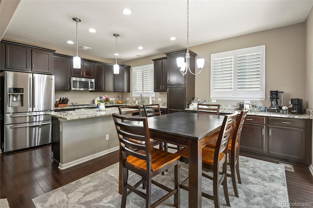 3014 E 143rd Dr, Thornton, CO 80602 - dining room featuring recessed lighting and dark wood-style floors