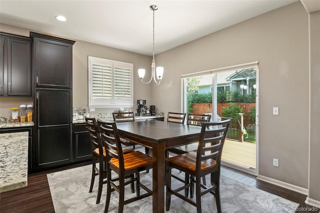 3014 E 143rd Dr, Thornton, CO 80602 - dining space featuring a chandelier, dark wood-style floors, and recessed lighting