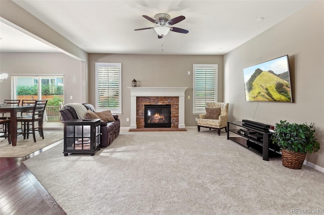 3014 E 143rd Dr, Thornton, CO 80602 - living area with a ceiling fan, a fireplace, and a chandelier