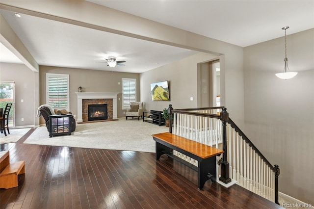 3014 E 143rd Dr, Thornton, CO 80602 - living area featuring a ceiling fan, a fireplace, and wood-type flooring