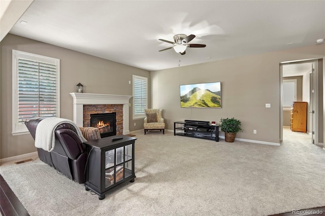 3014 E 143rd Dr, Thornton, CO 80602 - living room with a ceiling fan, a stone fireplace, and carpet
