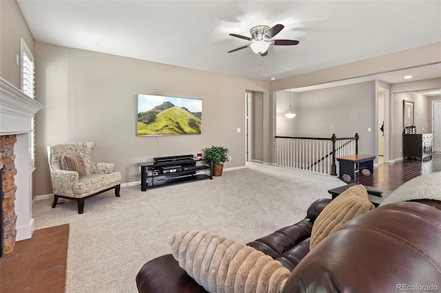 3014 E 143rd Dr, Thornton, CO 80602 - carpeted living area with a ceiling fan and a stone fireplace