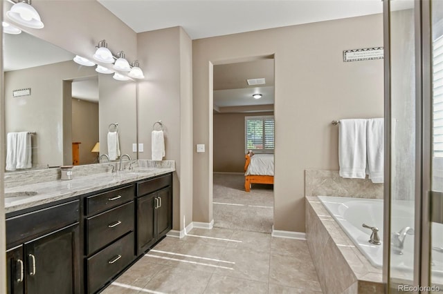 3014 E 143rd Dr, Thornton, CO 80602 - full bath with double vanity, ensuite bathroom, a bath, and tile patterned flooring