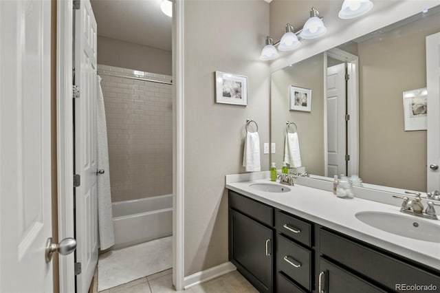 3014 E 143rd Dr, Thornton, CO 80602 - bathroom with double vanity, shower / bath combo, and tile patterned flooring
