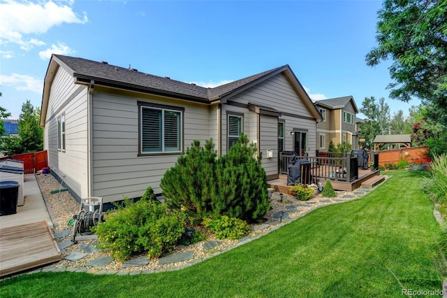 3014 E 143rd Dr, Thornton, CO 80602 - rear view of property featuring a wooden deck
