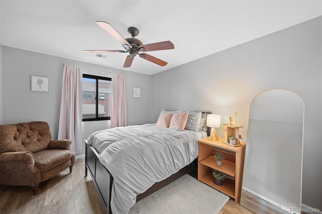 311 W Lehow Ave Unit 3, Englewood, CO 80110 - bedroom with ceiling fan, baseboards, visible vents, and wood finished floors