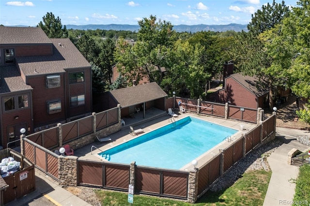 311 W Lehow Ave Unit 3, Englewood, CO 80110 - view of swimming pool featuring a fenced in pool, a mountain view, and fence