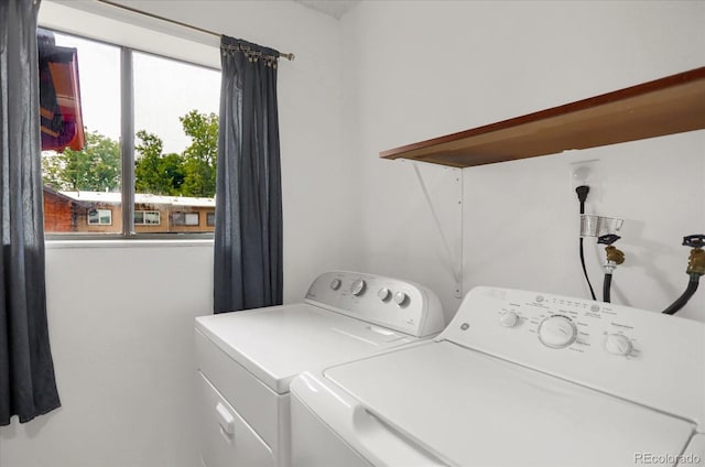 washroom with laundry area and independent washer and dryer