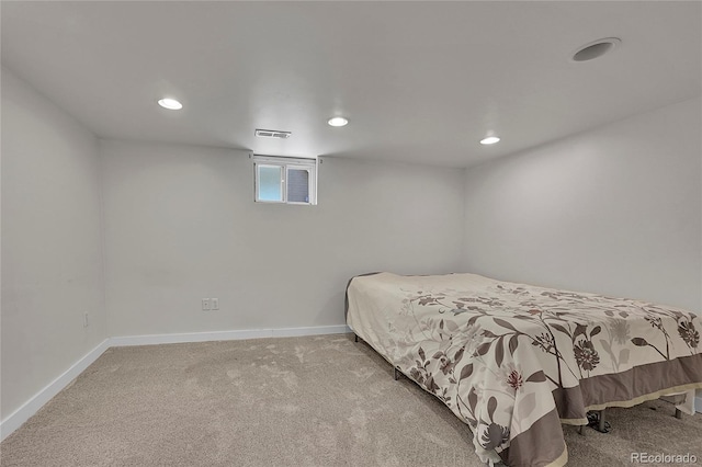 carpeted bedroom featuring baseboards, recessed lighting, and visible vents