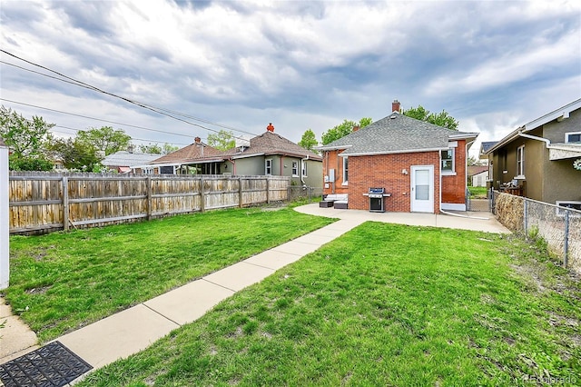 view of yard featuring a fenced backyard and a patio