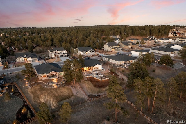 bird's eye view featuring a residential view and a view of trees