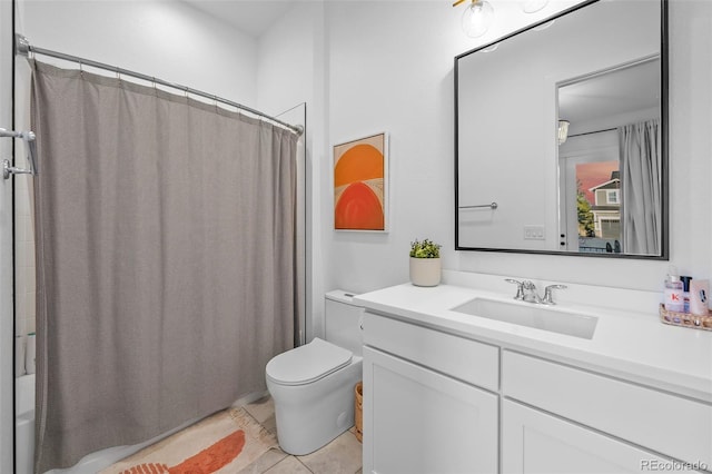 full bath with vanity, tile patterned floors, toilet, and shower / bath combo