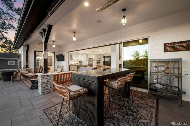 patio terrace at dusk with an outdoor hangout area