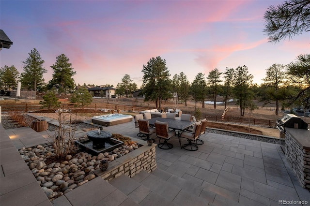 view of patio with area for grilling and outdoor dining space