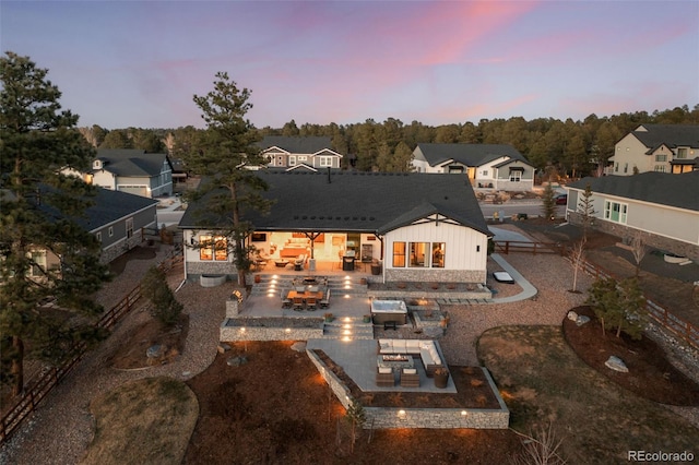 back of house featuring outdoor dining area, a patio, and area for grilling