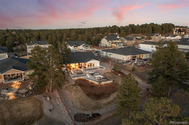 birds eye view of property with a residential view and a forest view