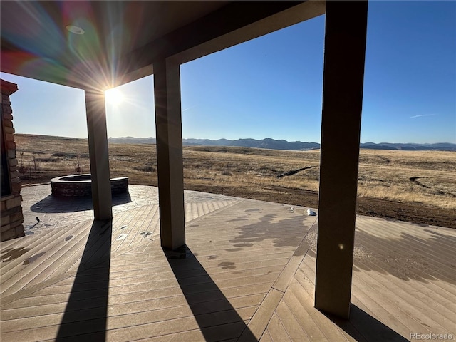 deck featuring a rural view and a mountain view