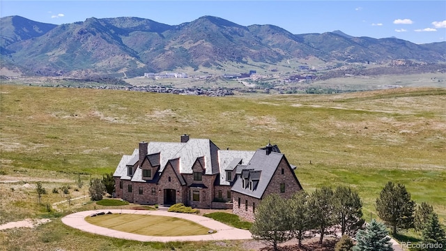 exterior space featuring a rural view and a mountain view