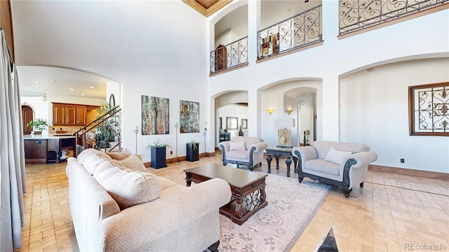 living room featuring a high ceiling