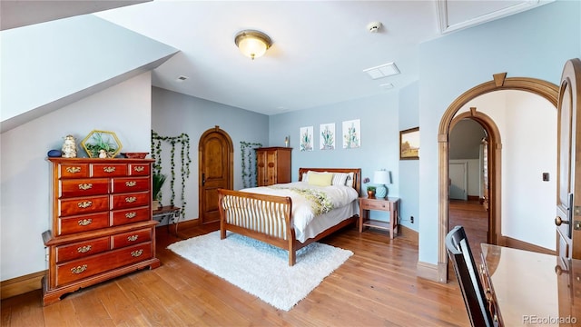 bedroom with light hardwood / wood-style floors