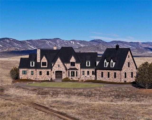 view of front of home featuring a mountain view