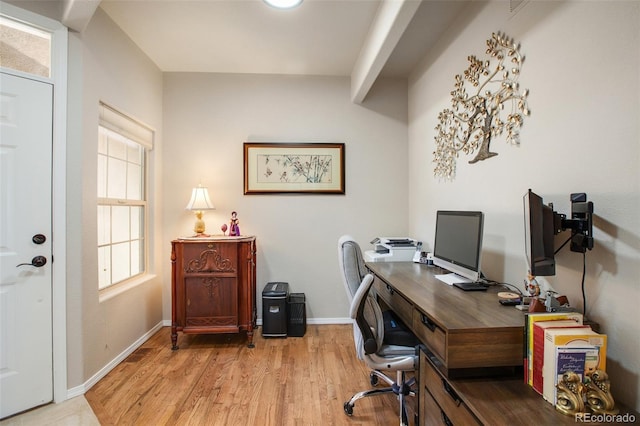 office area with baseboards and wood finished floors