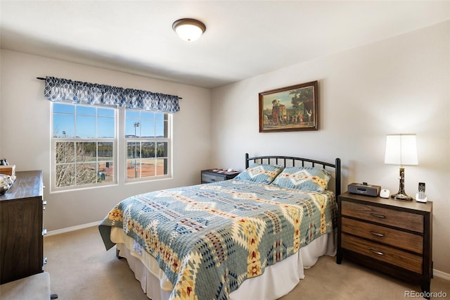 carpeted bedroom with baseboards